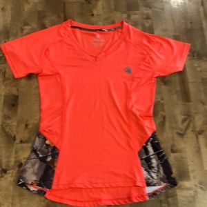 Legendary whitetail small shirt. Camo with orange. 90% polyester, 10% spandex.